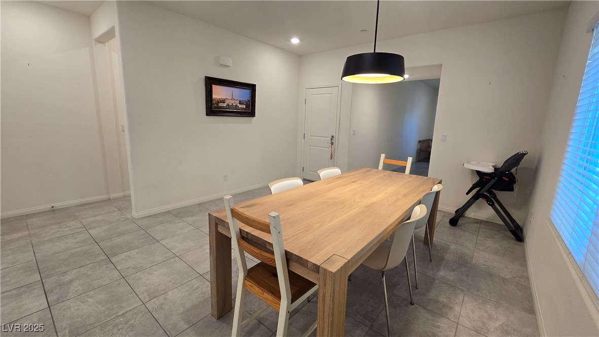 10971 Meridian Fields Avenue Las Vegas, NV 89166 - Photo 12 of 66 Tiled dining area with baseboards and recessed lighting