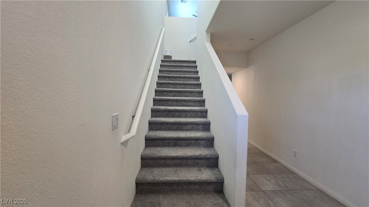 10971 Meridian Fields Avenue Las Vegas, NV 89166 - Photo 30 of 66 Stairs featuring tile patterned floors