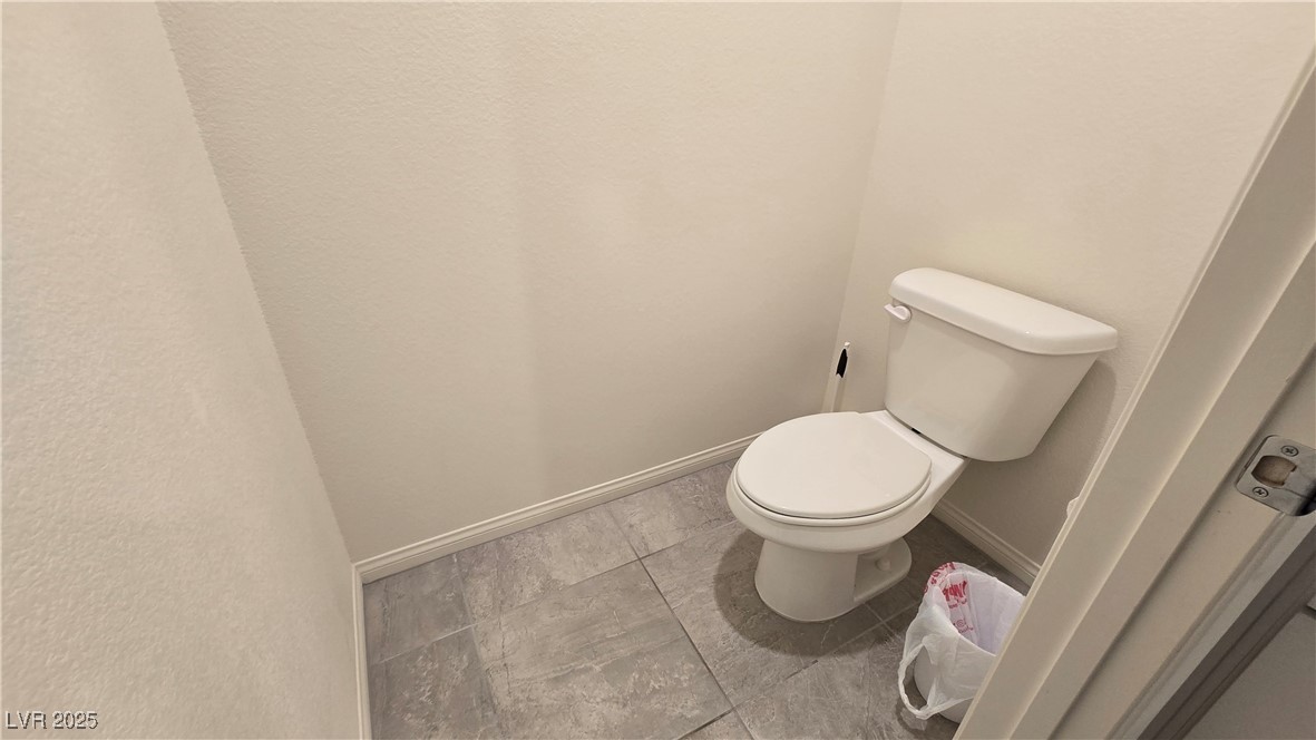 10971 Meridian Fields Avenue Las Vegas, NV 89166 - Photo 36 of 66 Bathroom featuring baseboards and tile patterned floors