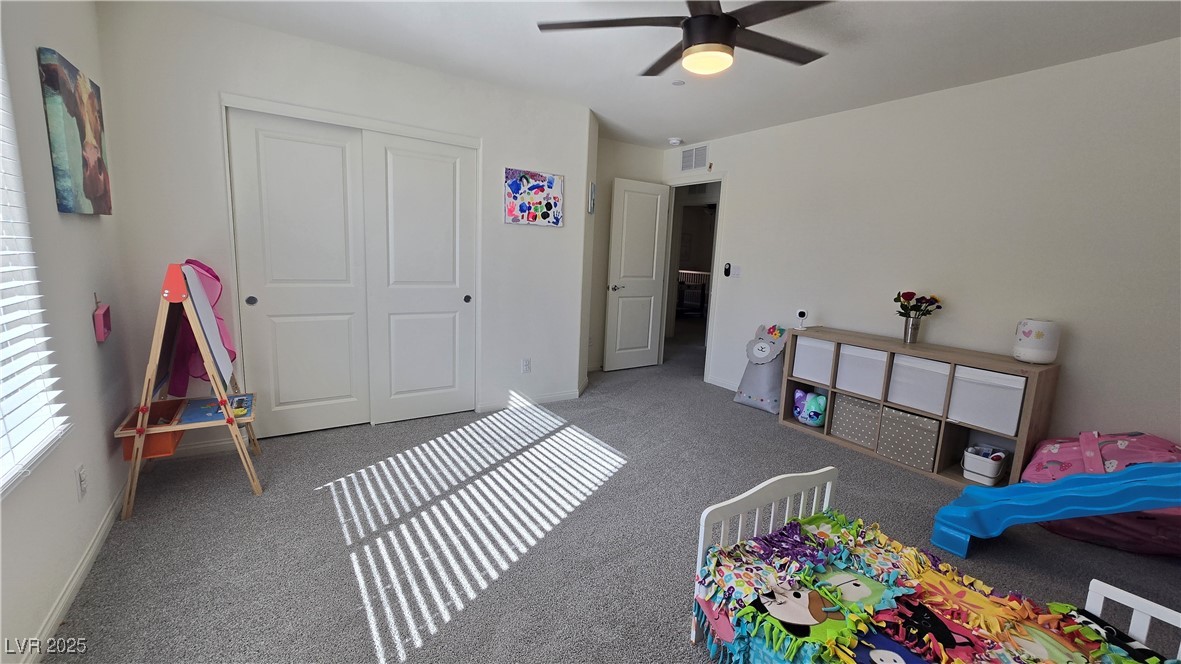 10971 Meridian Fields Avenue Las Vegas, NV 89166 - Photo 50 of 66 Carpeted bedroom featuring a closet and ceiling fan