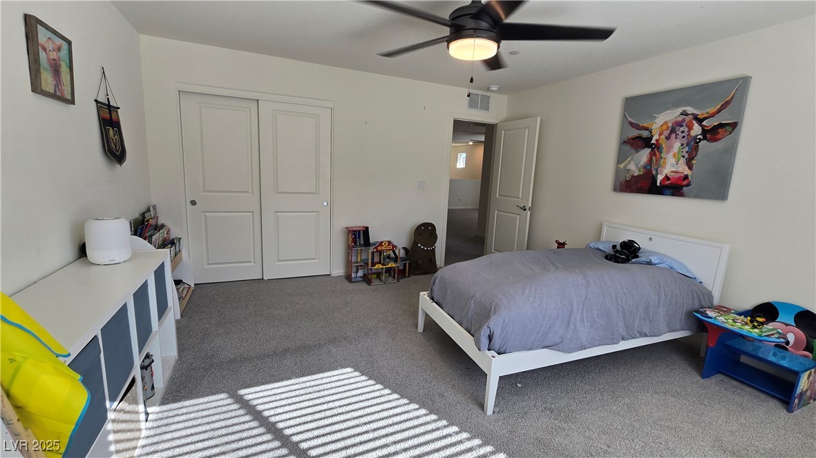 10971 Meridian Fields Avenue Las Vegas, NV 89166 - Photo 52 of 66 Carpeted bedroom featuring a closet and ceiling fan