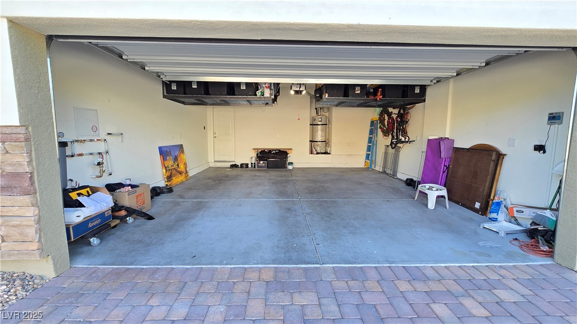10971 Meridian Fields Avenue Las Vegas, NV 89166 - Photo 56 of 66 Garage with water heater