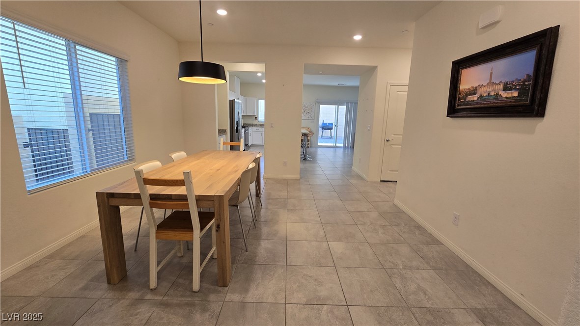10971 Meridian Fields Avenue Las Vegas, NV 89166 - Photo 9 of 66 Dining area with recessed lighting and light tile patterned floors