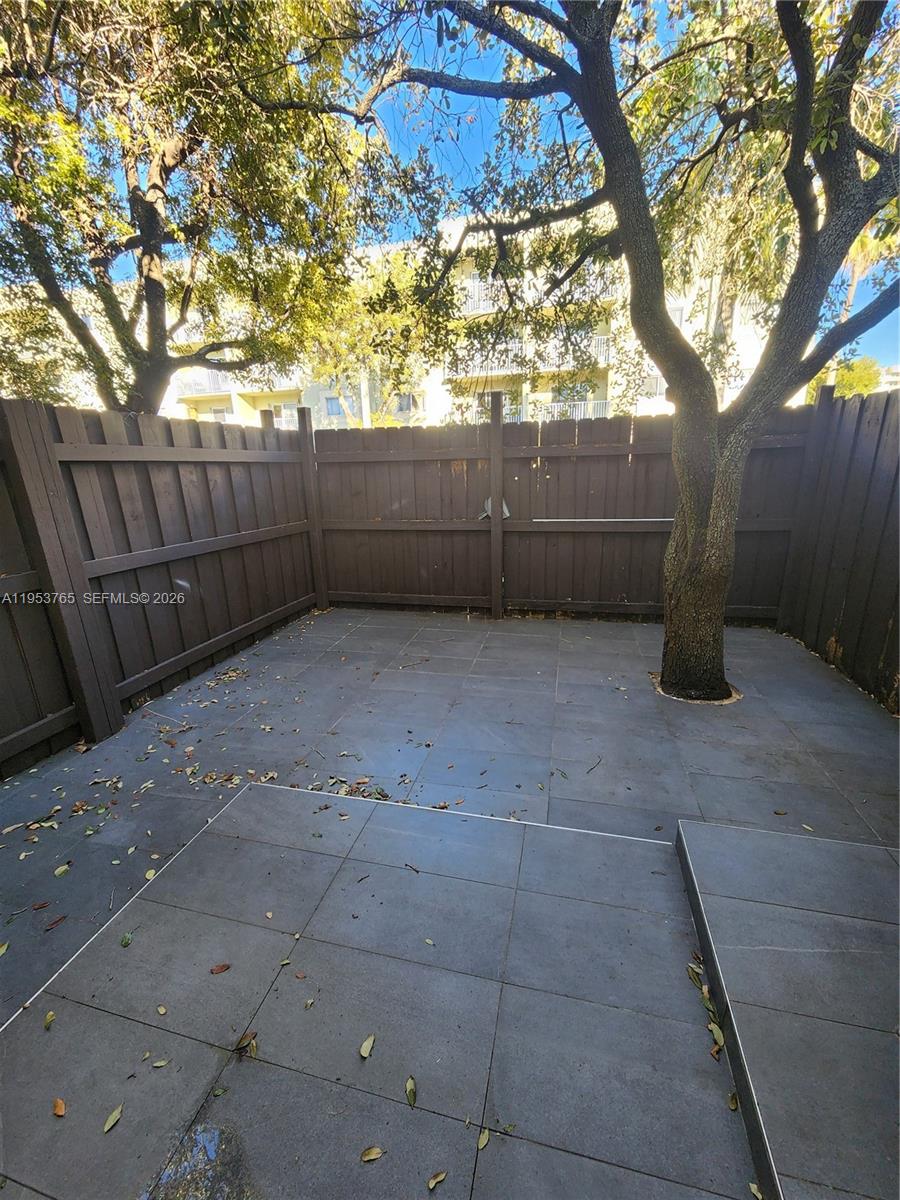 8025 Northwest 8th Street, Unit 10 Miami, FL 33126 - Photo 13 of 26 a view of backyard and tree