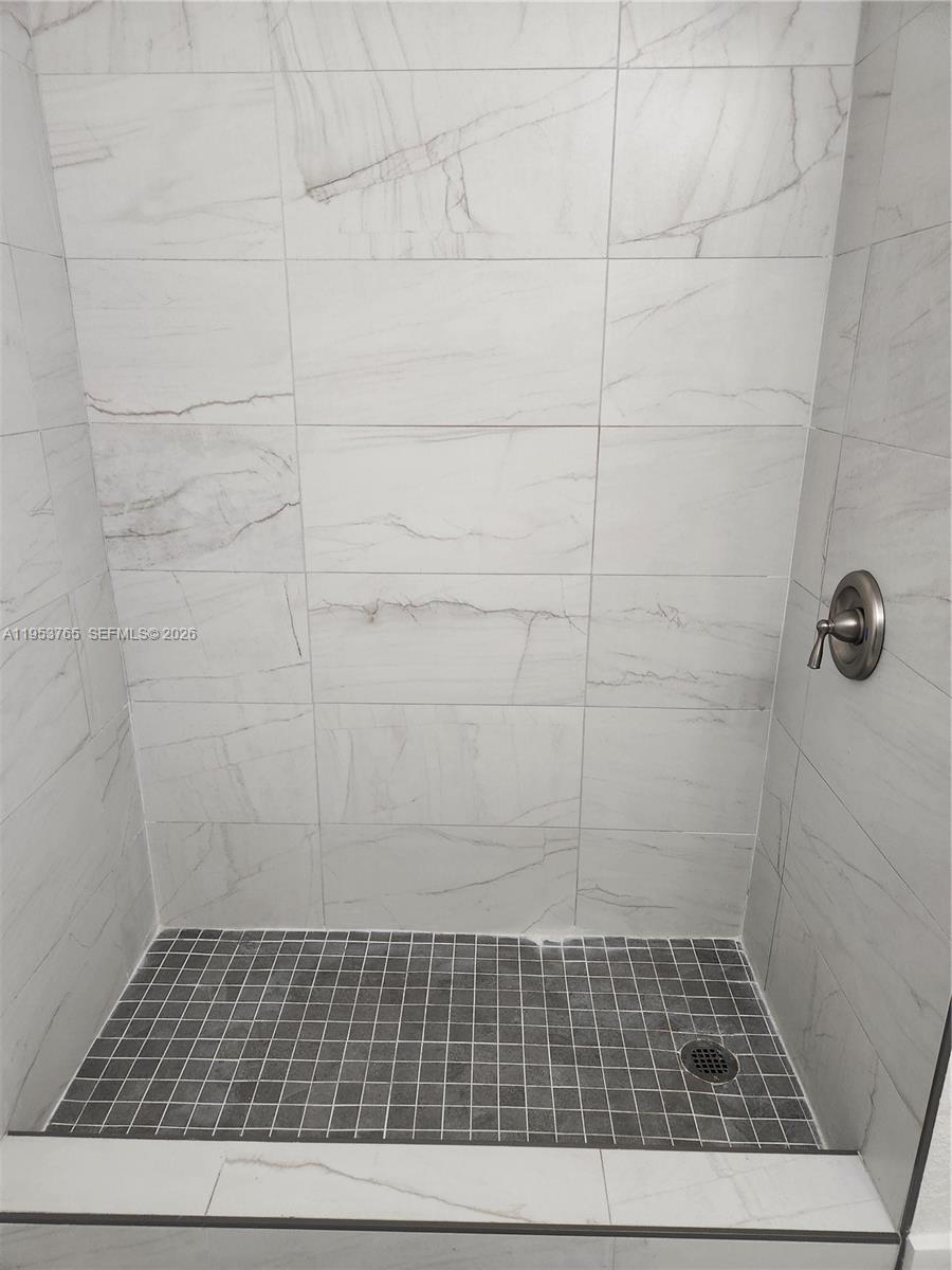8025 Northwest 8th Street, Unit 10 Miami, FL 33126 - Photo 21 of 26 a bathroom with a shower