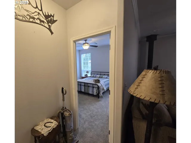 a en suite bathroom with a granite countertop sink and a mirror