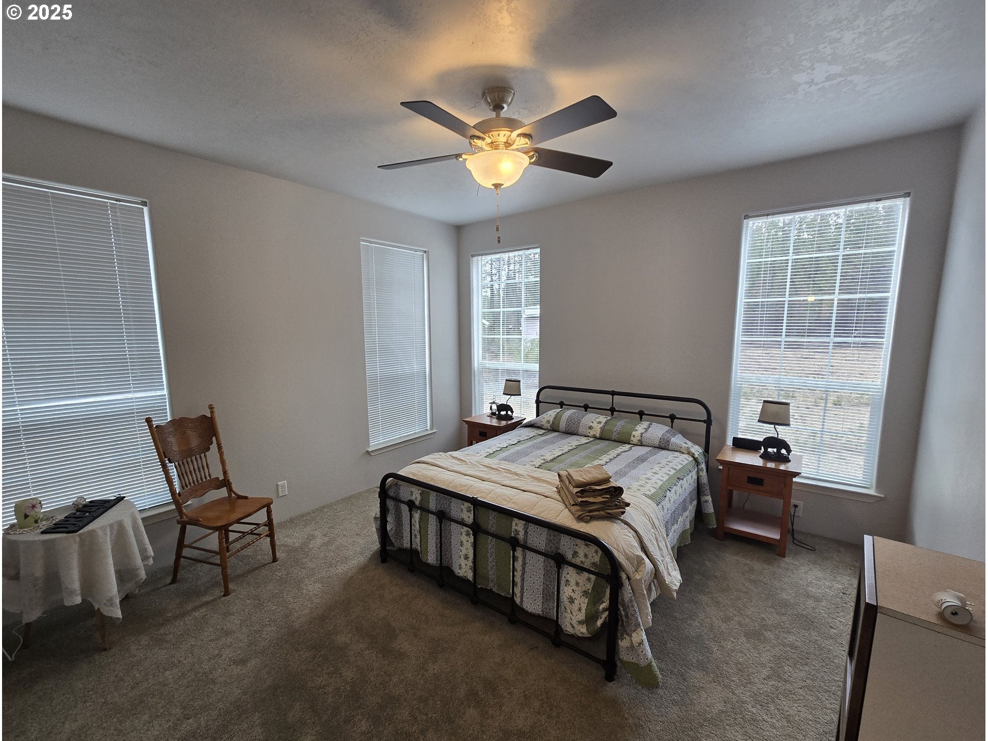 125220 Cappy Court Crescent Lake, OR 97733 - Photo 20 of 34 a bed sitting in a bedroom next to a window