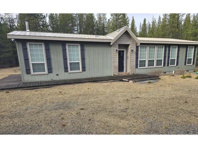 a front view of a house with yard