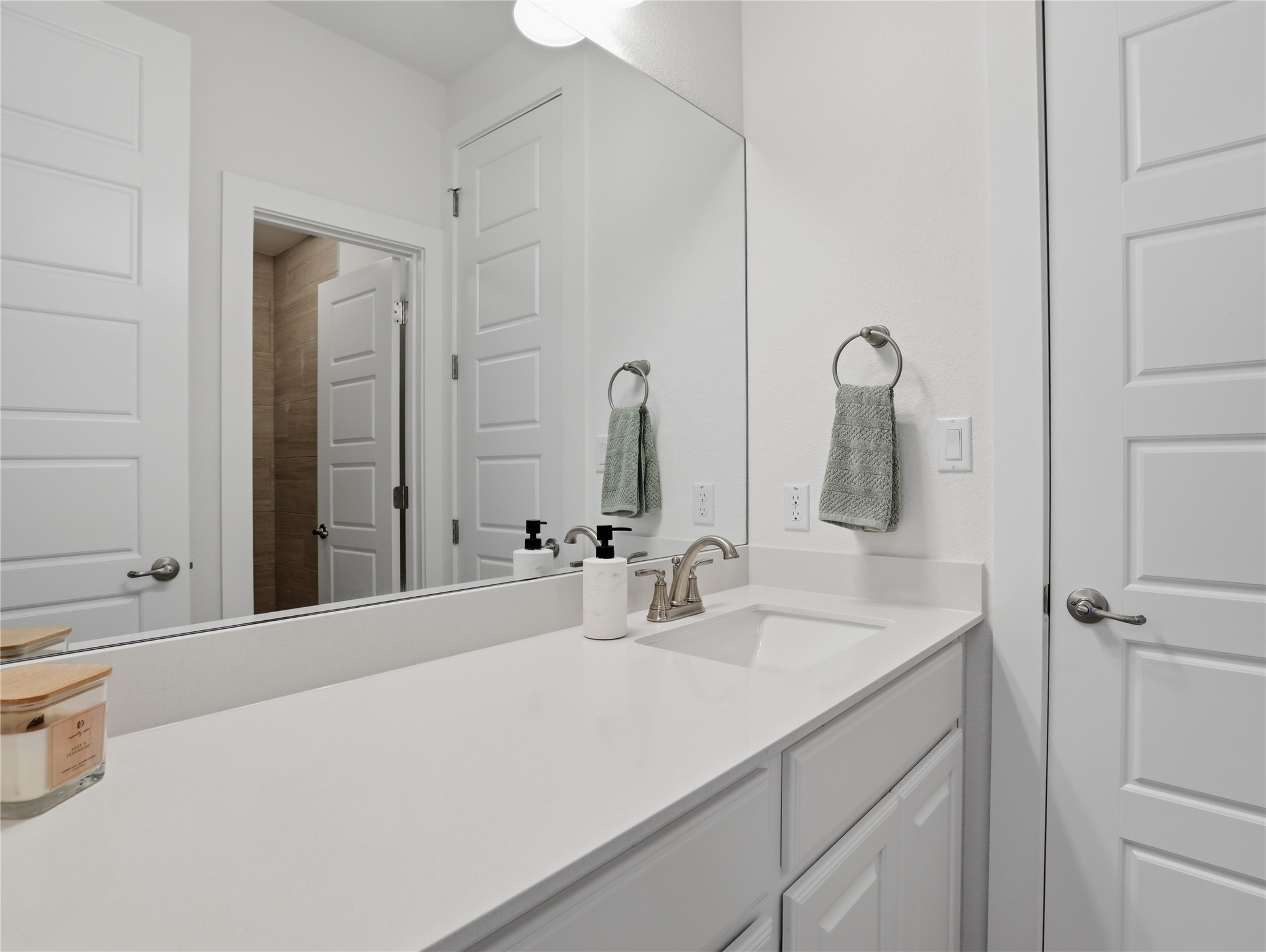 316 Raptor Beak Way Cedar Creek, TX 78612 - Photo 21 of 30 a bathroom with double vanity sink and a mirror