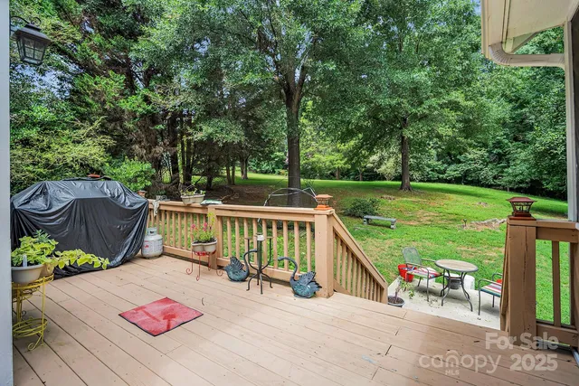 a view of a two chairs and table in the patio
