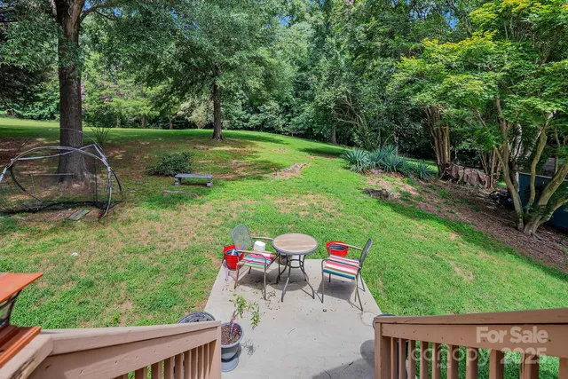 a view of backyard with seating and green space
