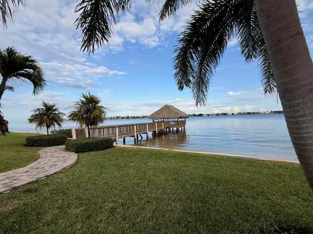 a view of a garden with a house