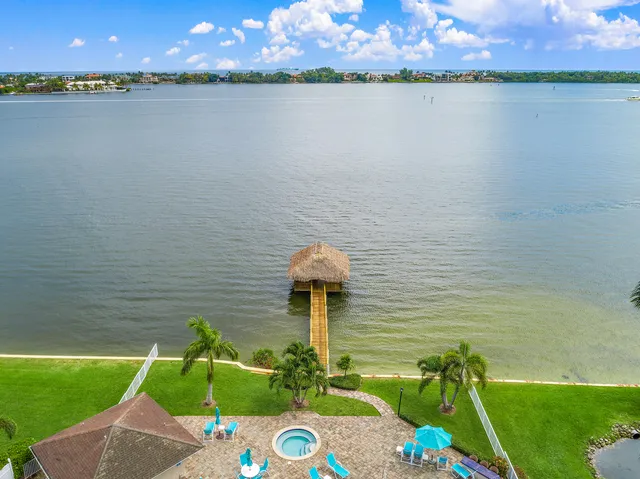a front view of a house with a lake view