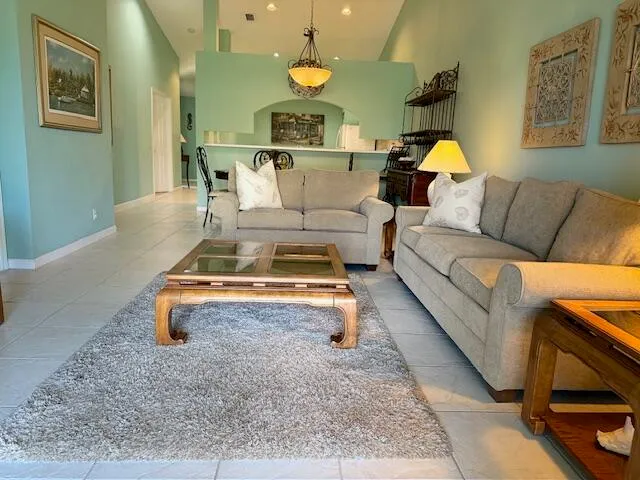 a living room with furniture and a rug