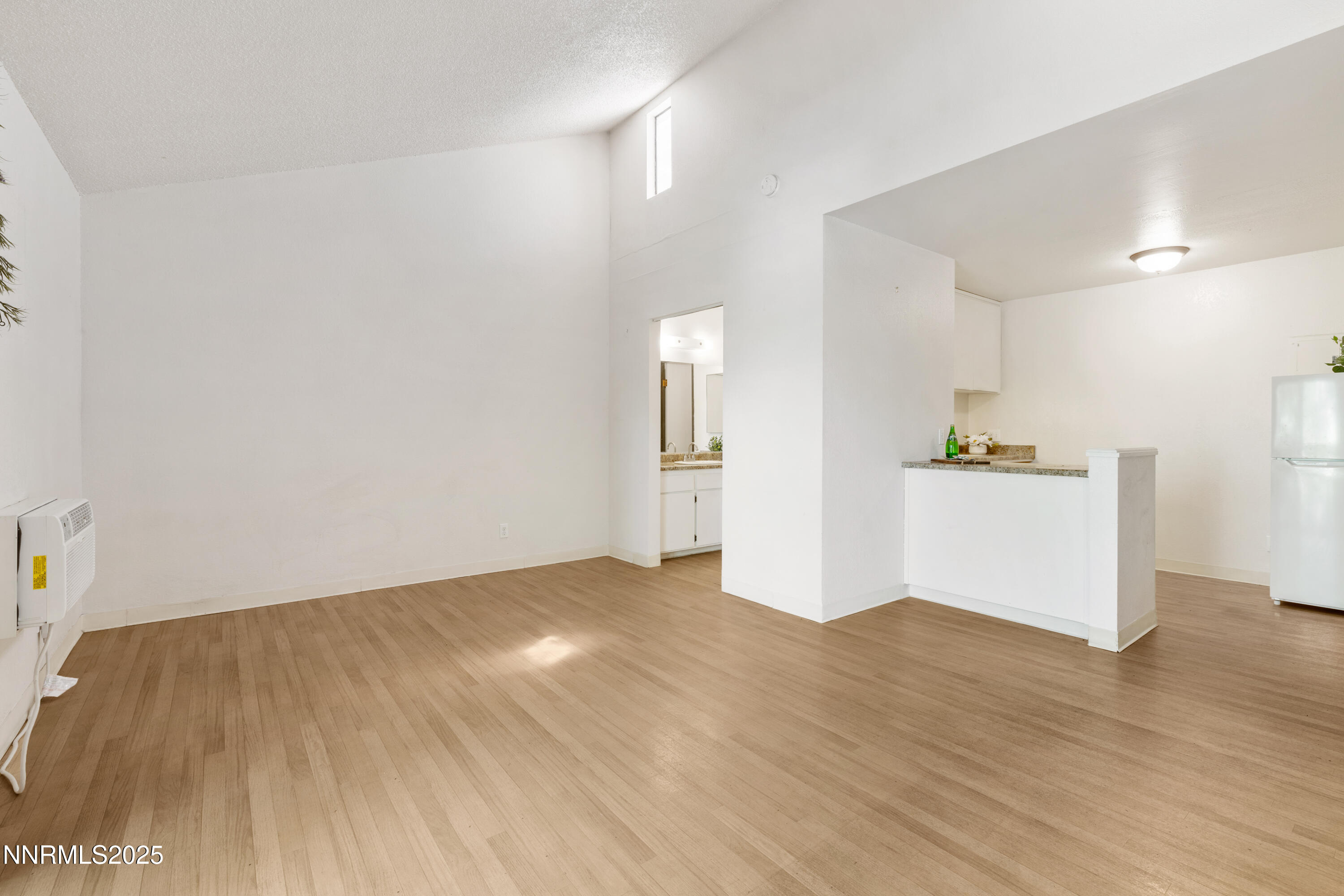 2450 Lymbery Street, Unit 307 Reno, NV 89509 - Photo 13 of 16 a view of empty room with wooden floor