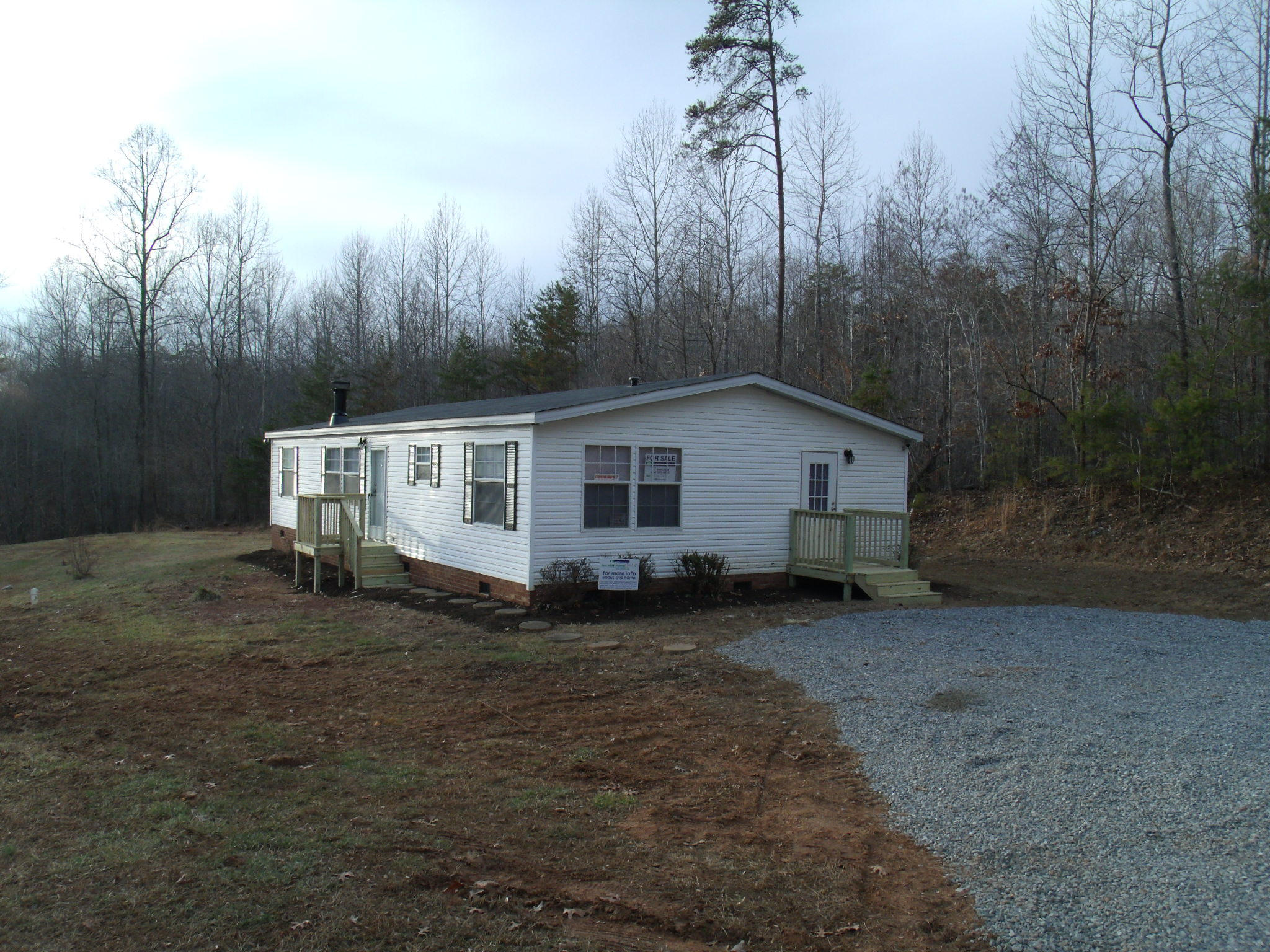 384 Kelly Mill Road Stuart, VA 24171 - Photo 2 of 15 a view of a house with a yard