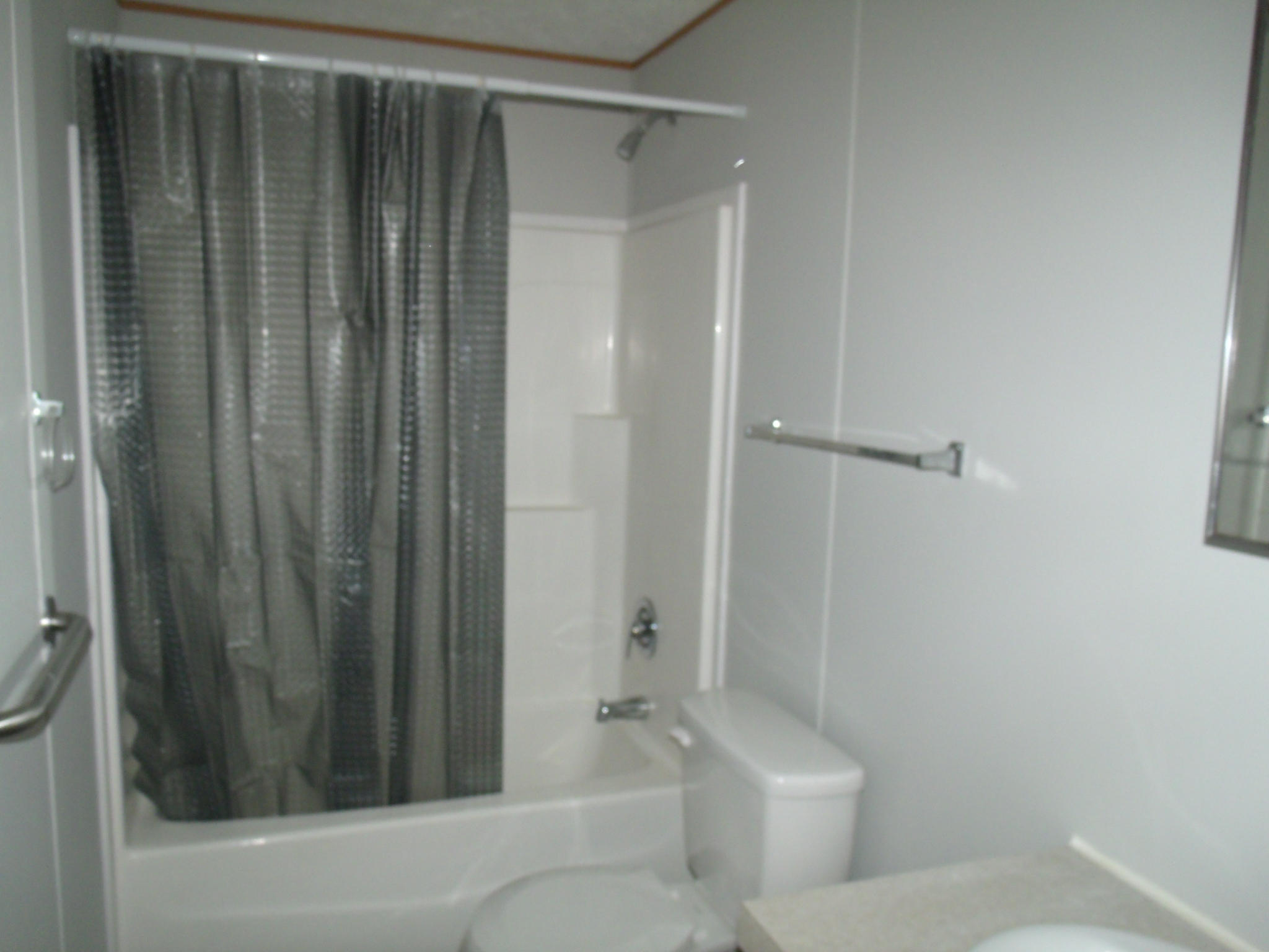 384 Kelly Mill Road Stuart, VA 24171 - Photo 11 of 15 a bathroom with a shower and a toilet