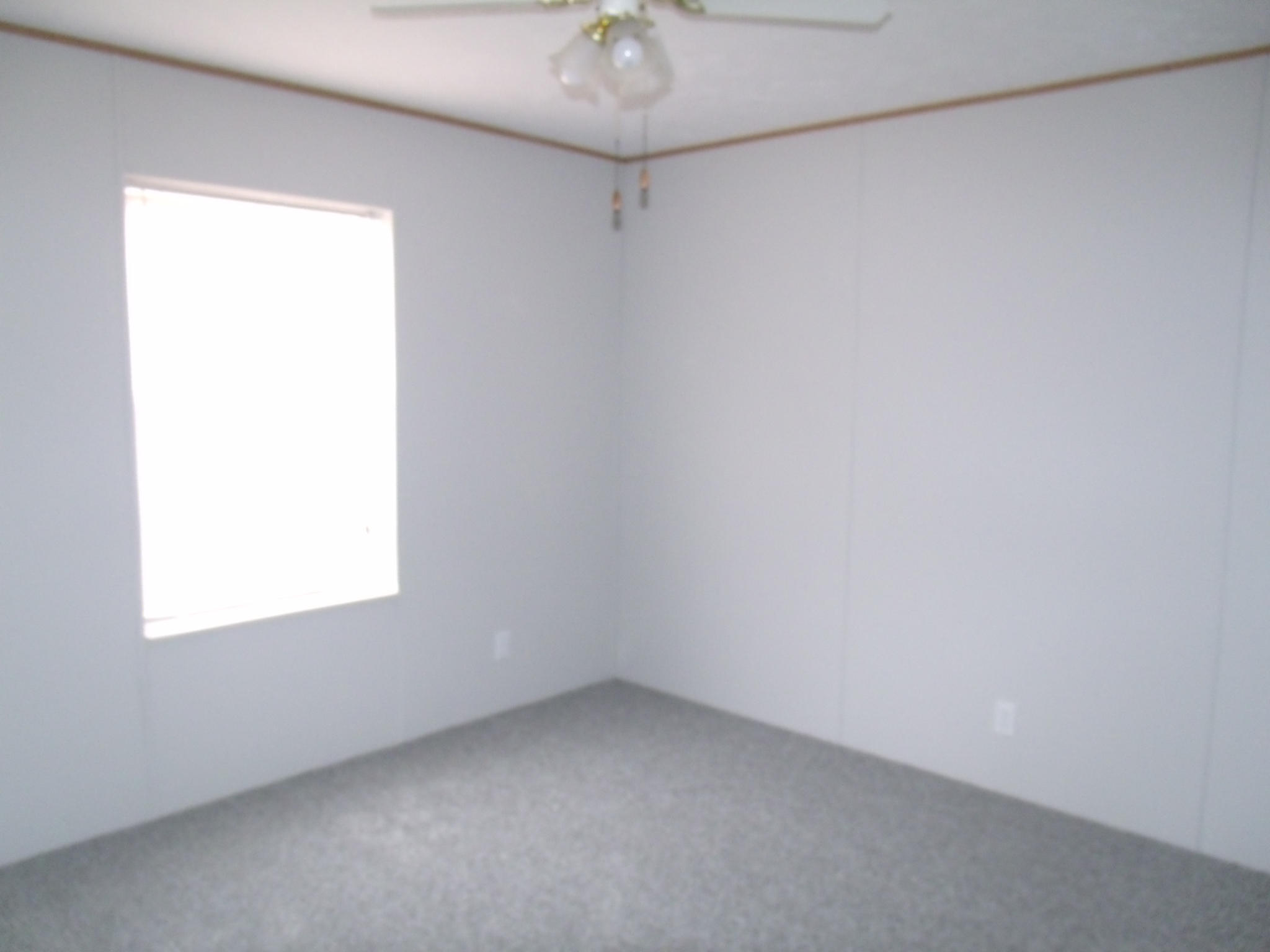 384 Kelly Mill Road Stuart, VA 24171 - Photo 12 of 15 a view of a small space with a window and a fan