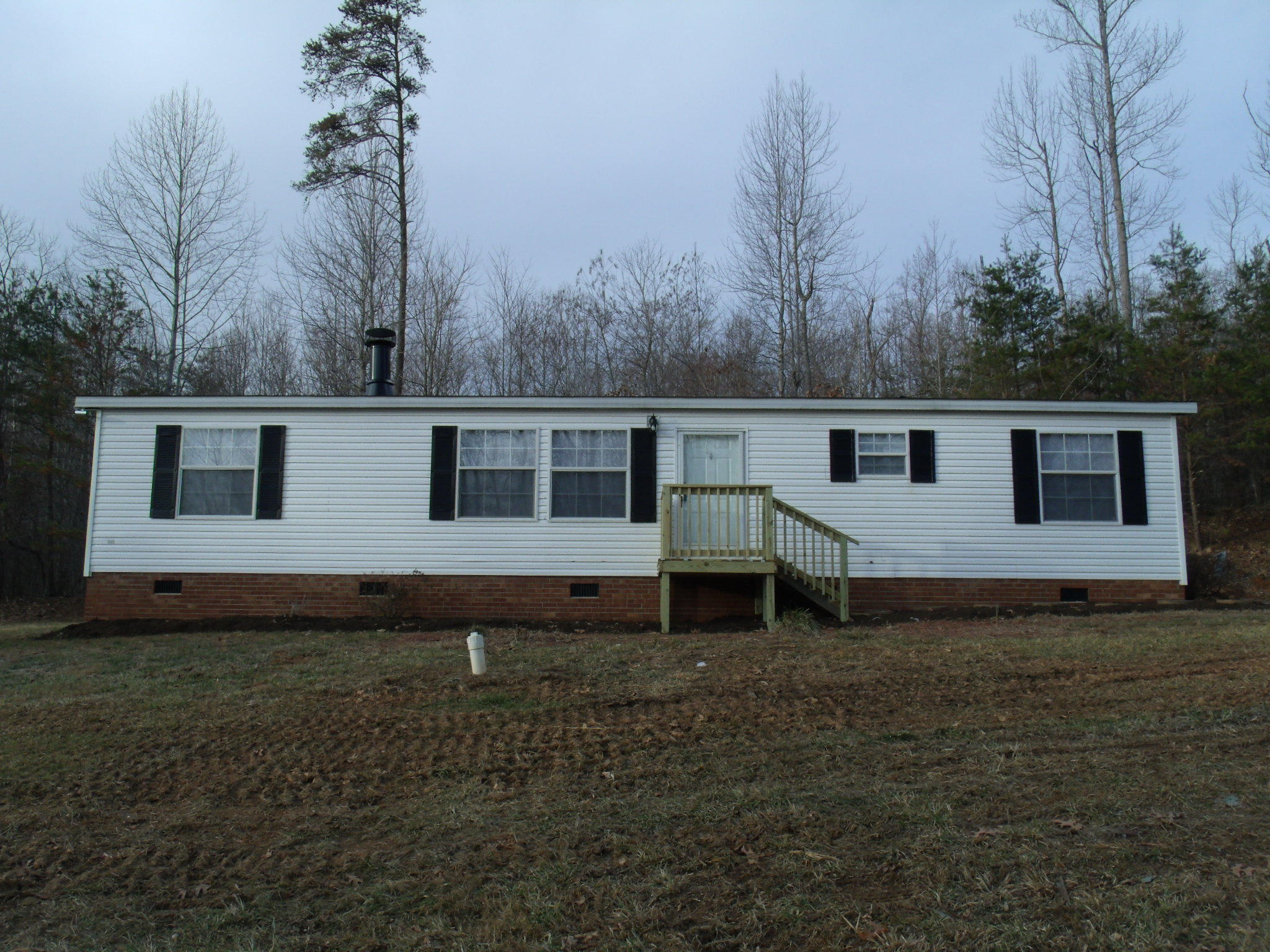 384 Kelly Mill Road Stuart, VA 24171 - Photo 3 of 15 a view of a house with backyard and trees