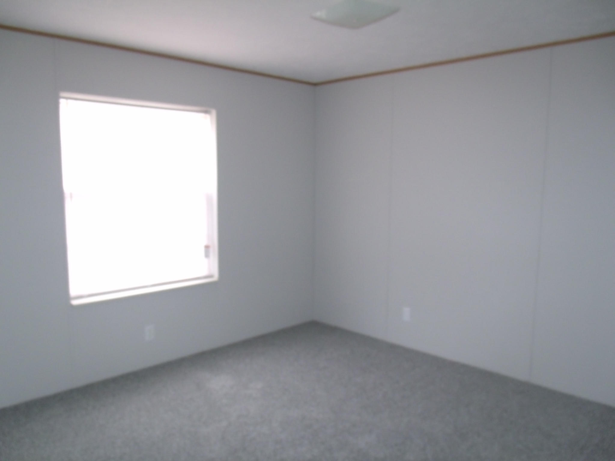 384 Kelly Mill Road Stuart, VA 24171 - Photo 10 of 15 an empty room with a window