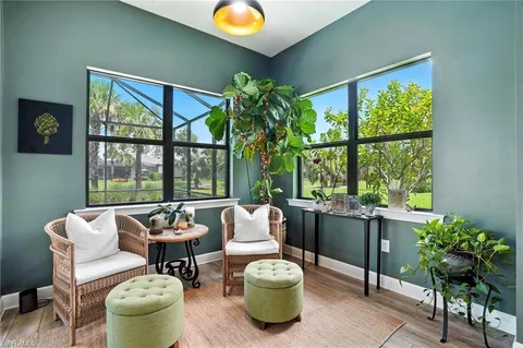 a living room with a fireplace and a window