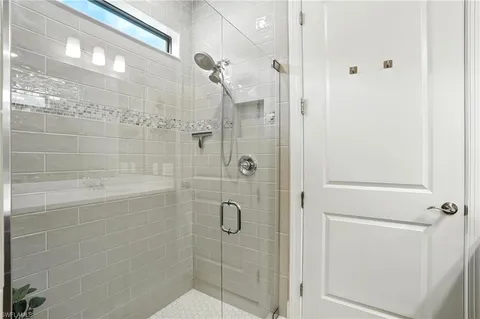 a bathroom with a toilet and a shower curtain