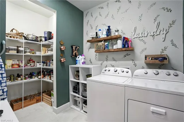 a view of swimming pool with couch and chairs