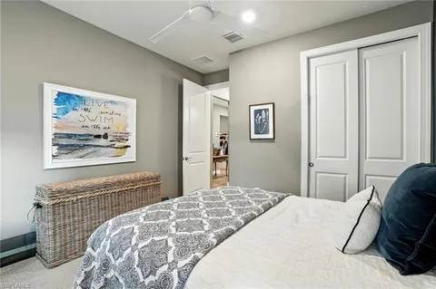 a view of swimming pool with couch and chairs