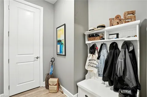 a swimming pool with table and chairs