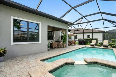 a view of an outdoor sitting area with furniture