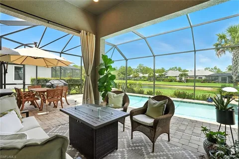 a front view of a house with yard and green space