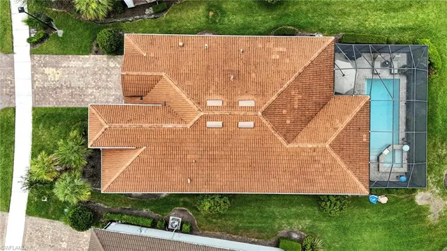 a front view of a house with yard and green space