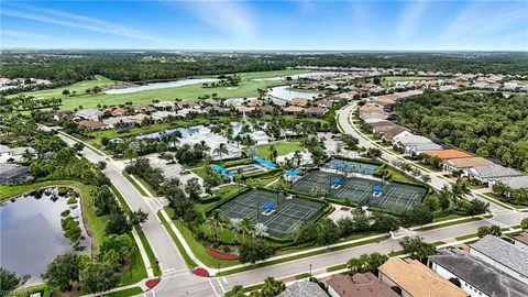 a picture of a bench in front of gate