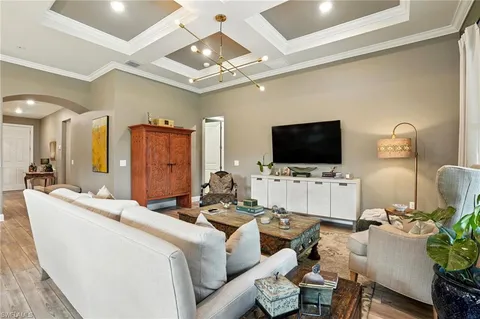 a large white kitchen with a large island