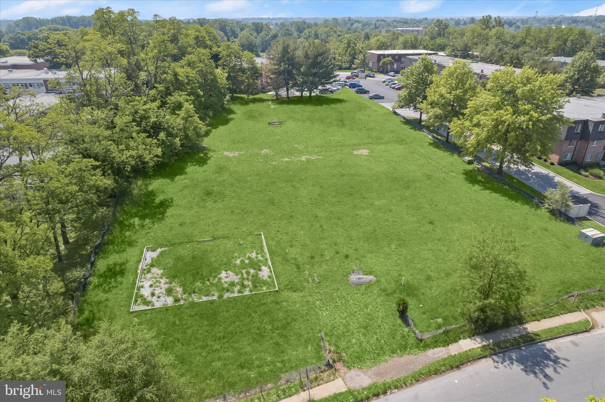3925 Rolling Rd. Baltimore, MD 21208 - Photo 4 of 27 a view of a green yard with large trees
