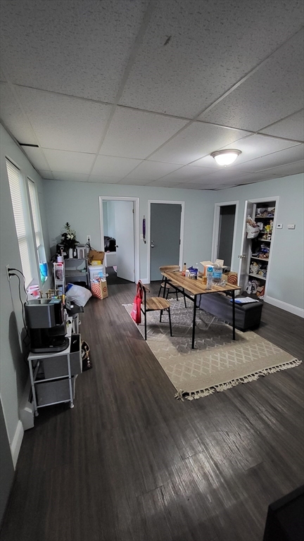 162 Riverside Street, Unit 2 Lowell, MA 01854 - Photo 3 of 12 a living room with furniture
