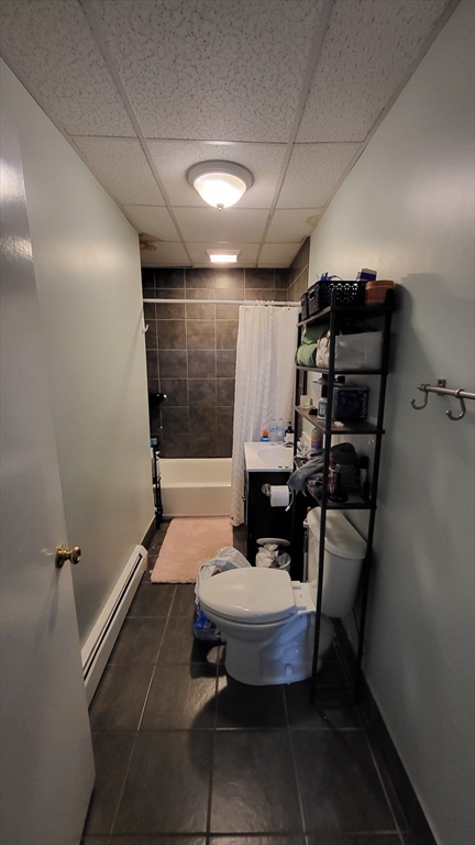 162 Riverside Street, Unit 2 Lowell, MA 01854 - Photo 6 of 12 a bathroom with a sink toilet and shower