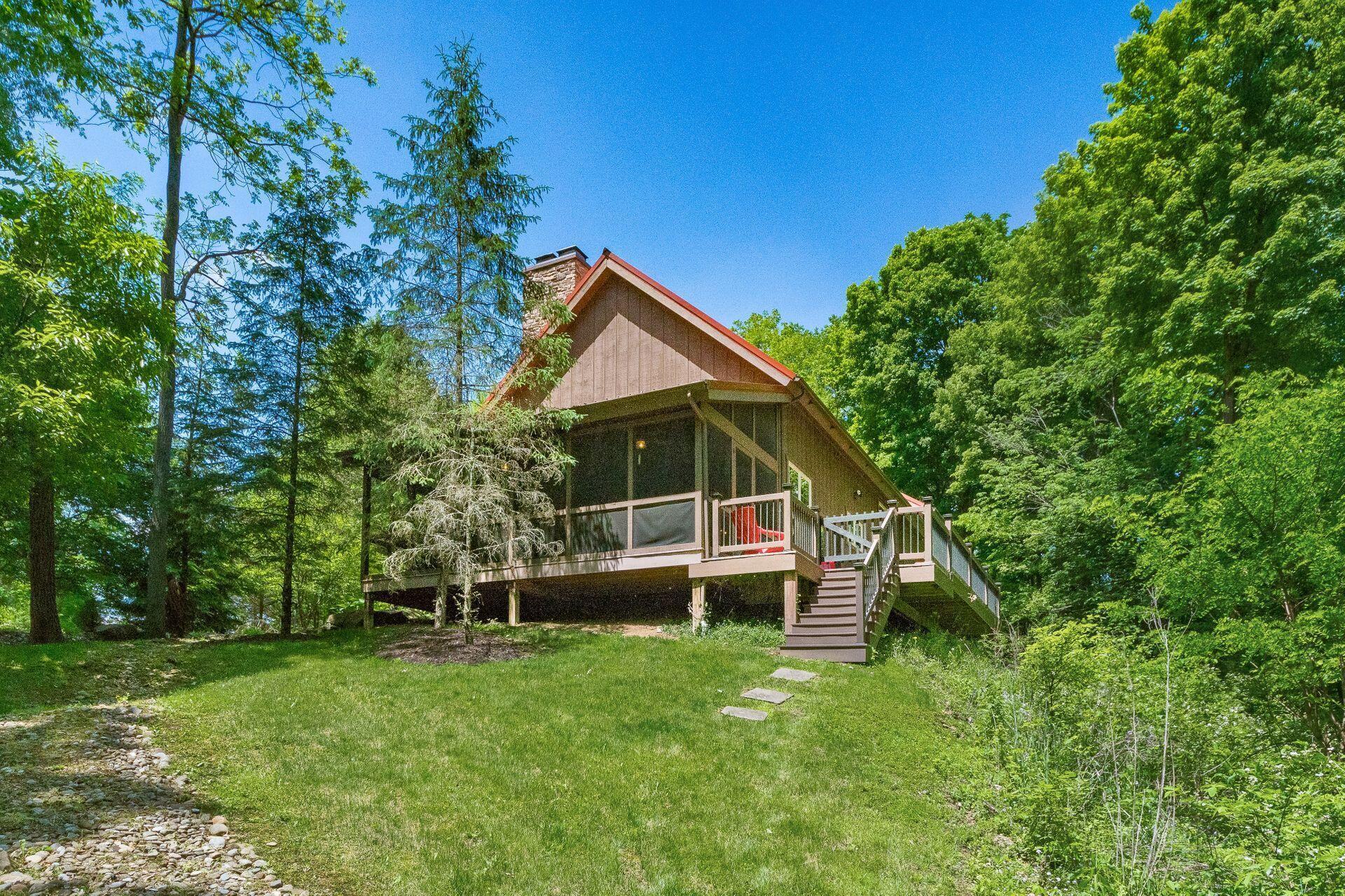 11444 Hazel Dell Road Howard, OH 43028 - Photo 6 of 41 The porch is charming and the place to relax and take in the sights and sounds.