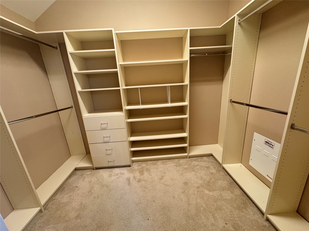 3219 Witney Way Fresno, TX 77545 - Photo 12 of 23 a view of walk in closet with empty racks
