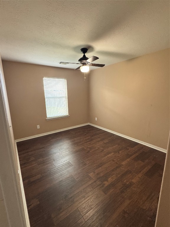 3219 Witney Way Fresno, TX 77545 - Photo 16 of 23 an empty room with wooden floor ceiling fan and windows