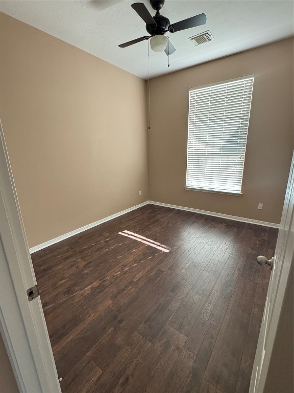 3219 Witney Way Fresno, TX 77545 - Photo 17 of 23 an empty room with wooden floor fan and windows