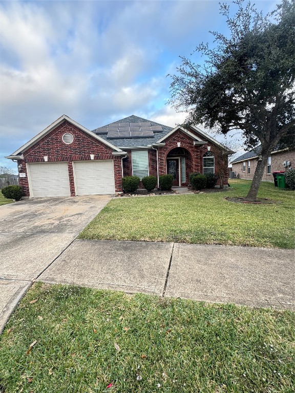 3219 Witney Way Fresno, TX 77545 - Photo 22 of 23 a front view of a house with a garden and trees