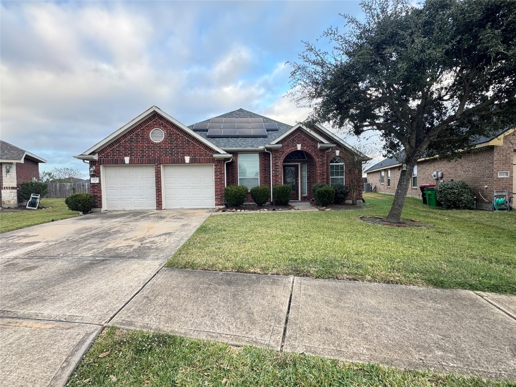 3219 Witney Way Fresno, TX 77545 - Photo 23 of 23 a front view of a house with garden