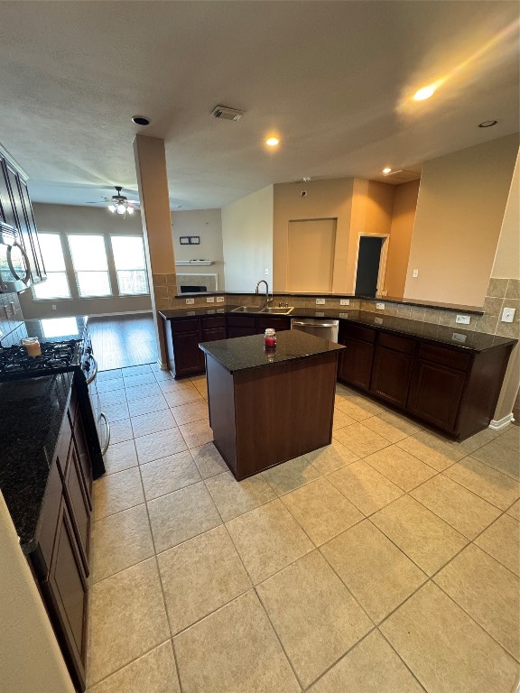 3219 Witney Way Fresno, TX 77545 - Photo 6 of 23 a kitchen with a sink and a stove top oven