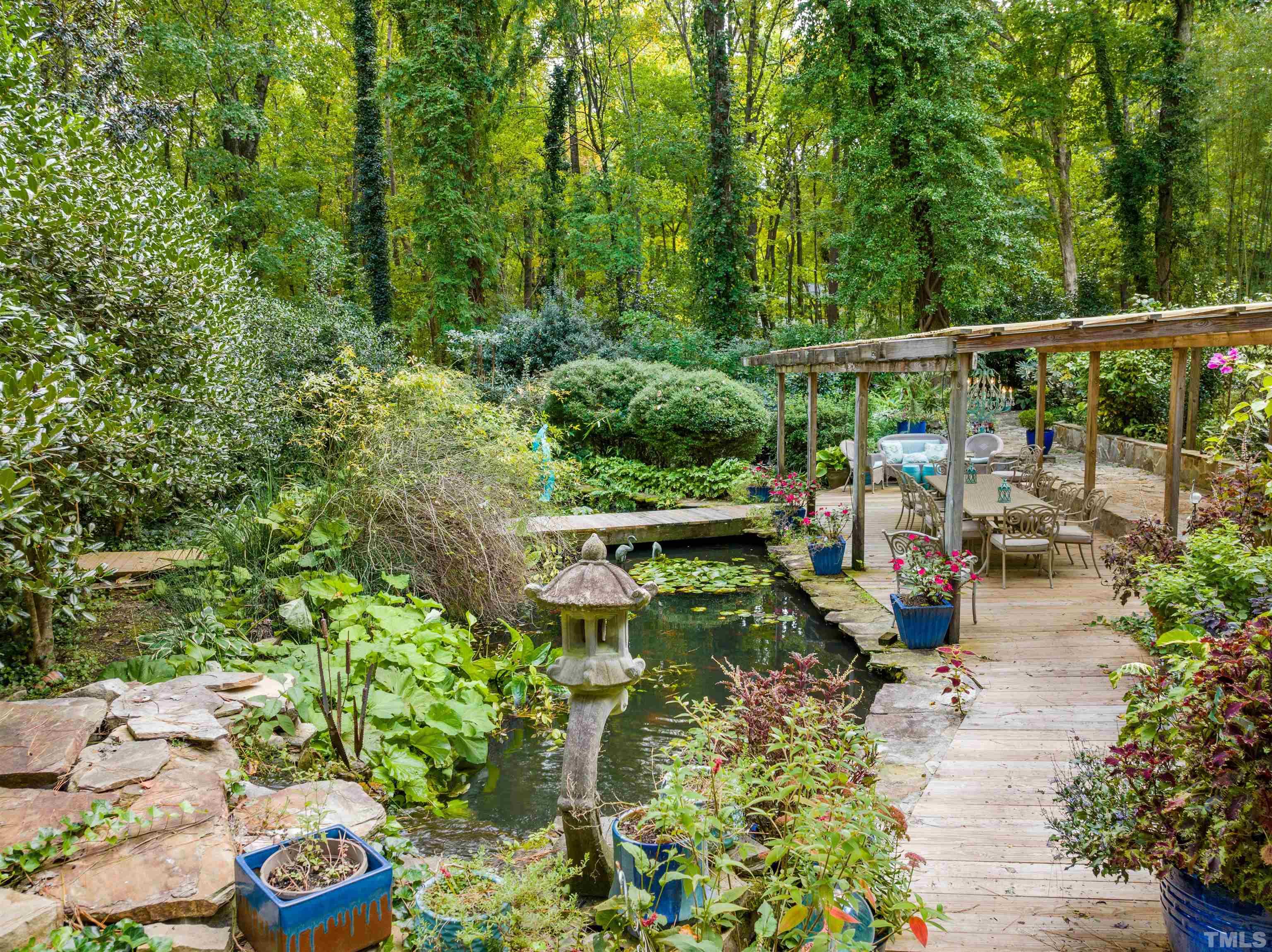 10101 East Roadstead Way Raleigh, NC 27613 - Photo 54 of 68 a view of a chair and tables on the patio