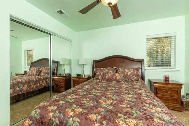 a bedroom with bed and window