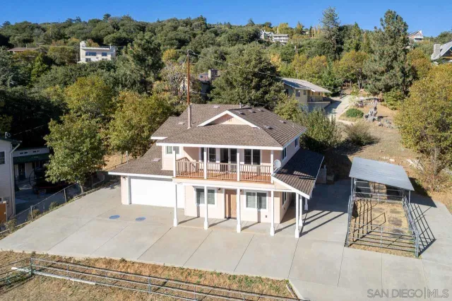 an aerial view of a house with a garden