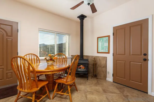 a dining room with furniture and window