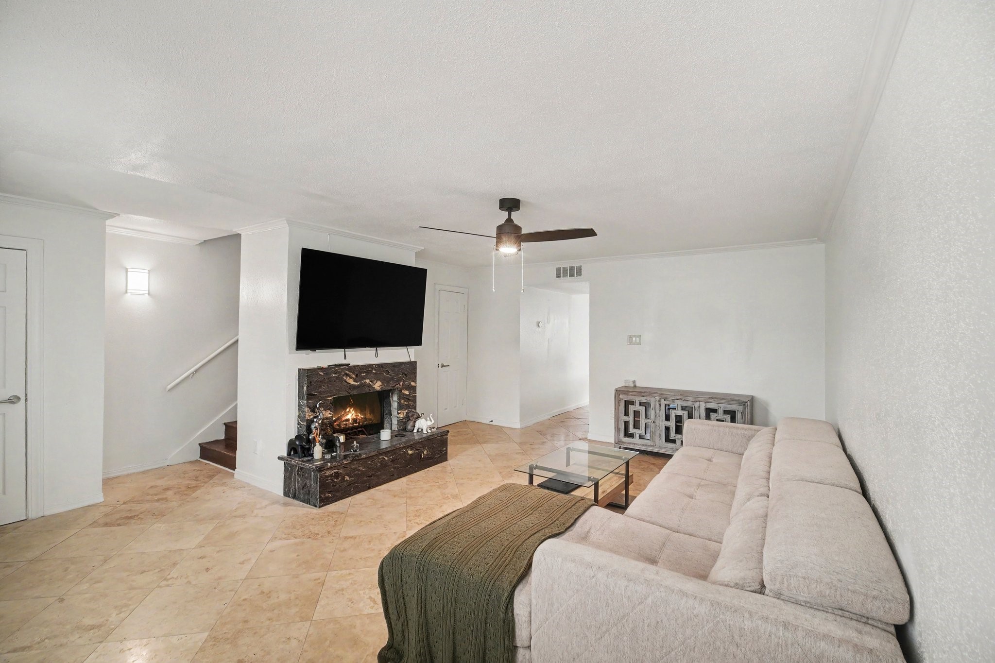 5801 Lumberdale Road, Unit 78 Houston, TX 77092 - Photo 3 of 35 Cozy living area featuring a stylish fireplace, perfect for relaxing evenings and warm gatherings.