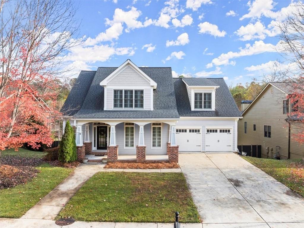 270 Old Canton Road Ball Ground, GA 30107 - Photo 1 of 1 a front view of a house with garden